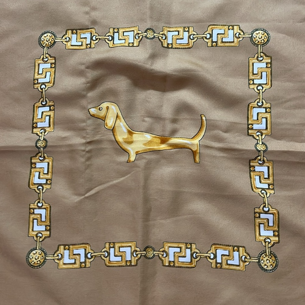 34” x 34” square scarf with dachshund, chains.  Cream, gold and tan color.